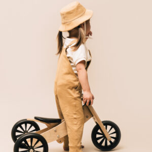 Toddler girl wearing jumpsuit and hat in pima cotton | UAUA Collections