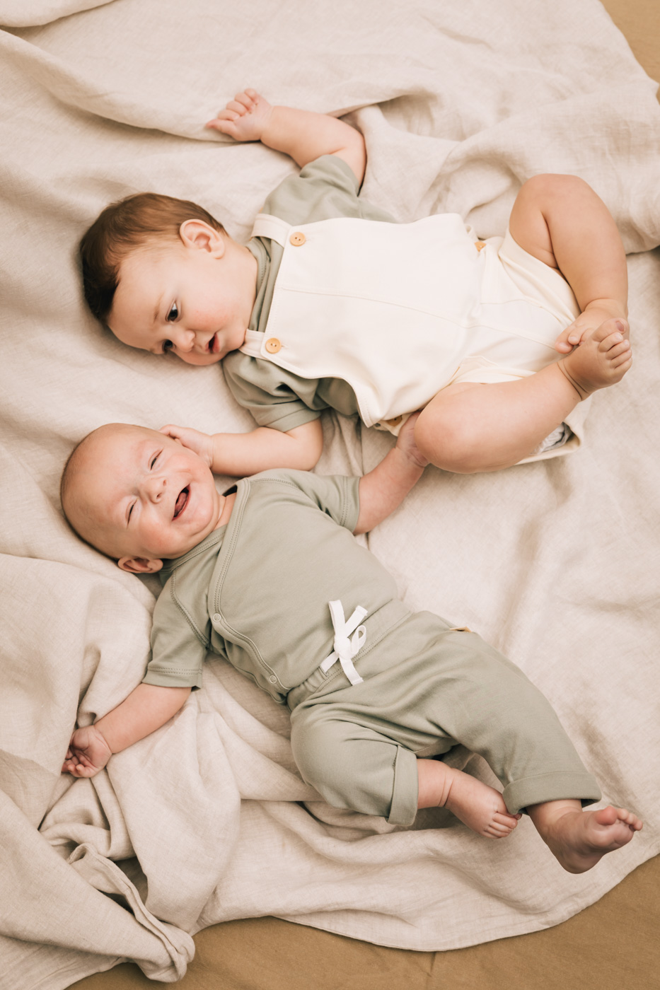 Two babies wearing the kimono set and jumpsuitof UAUA Collections | UAUA Collections